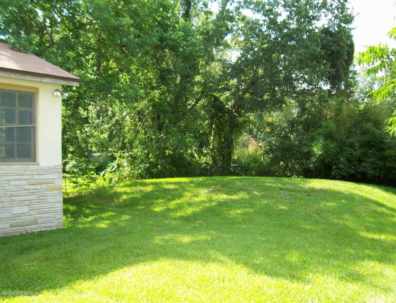 4609 Sunderland Road Jacksonville, FL 32210 - Photo 3 of 7 a view of a yard with a trees