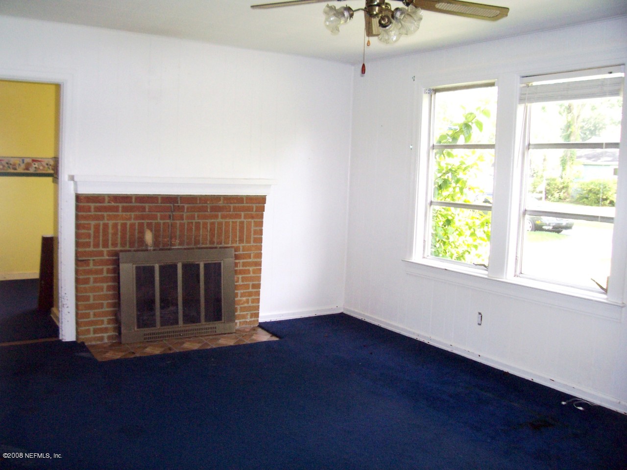 4609 Sunderland Road Jacksonville, FL 32210 - Photo 4 of 7 a view of empty room with wooden floor and fan