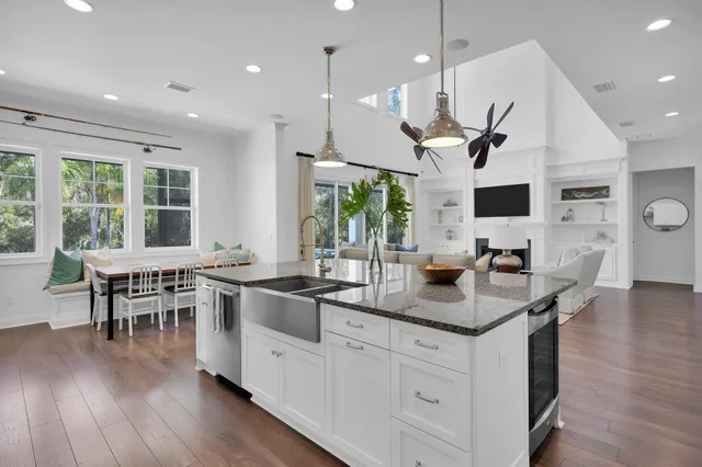a view of a livingroom with furniture wooden floor and entryway