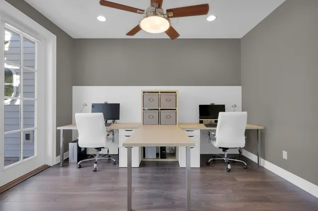 a spacious bedroom with a bed and a large window