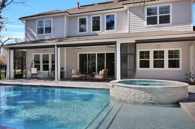 a view of balcony with small yard