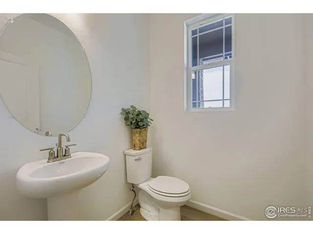 a dining room with furniture a window and a kitchen view
