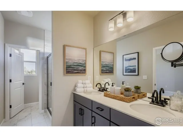 a spacious bedroom with a bed and a couch