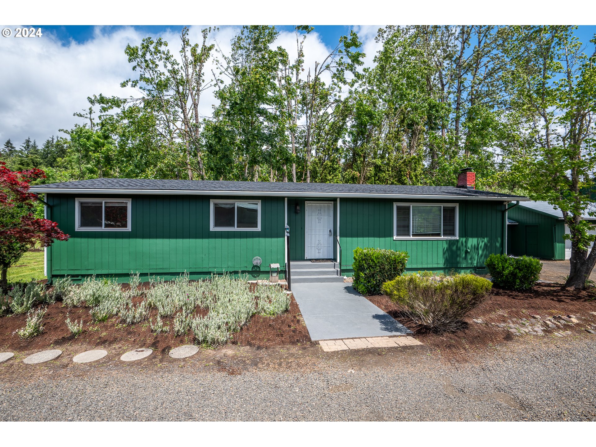 88439 Stephens Road Springfield, OR 97478 - Photo 1 of 30 a front view of a house with a yard and potted plants