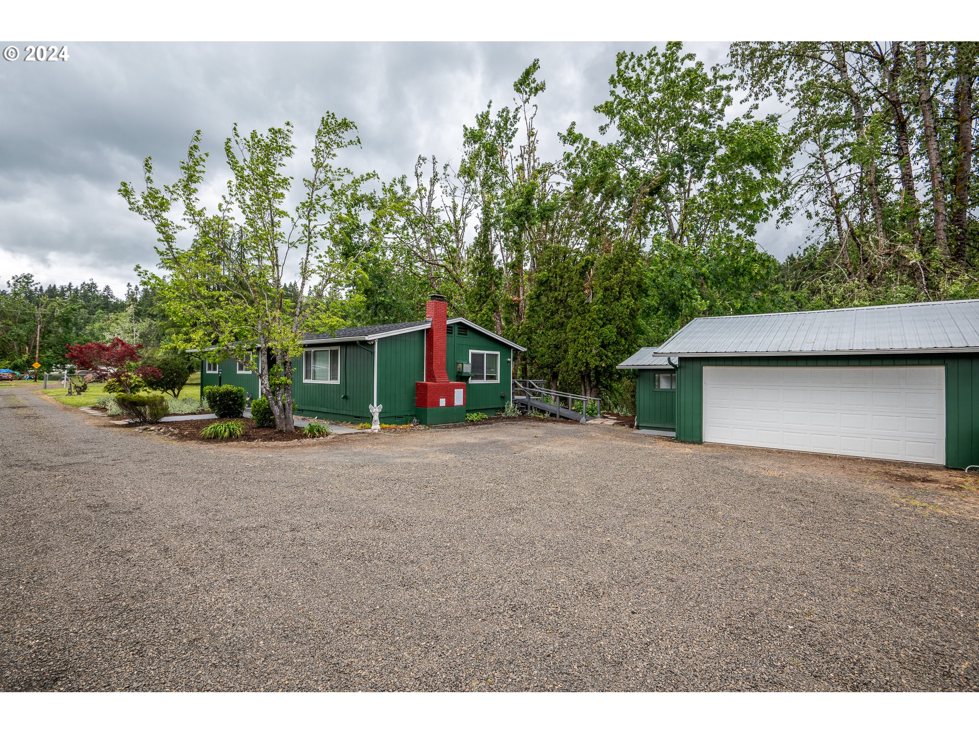 88439 Stephens Road Springfield, OR 97478 - Photo 21 of 30 a view of a house with a yard and garage
