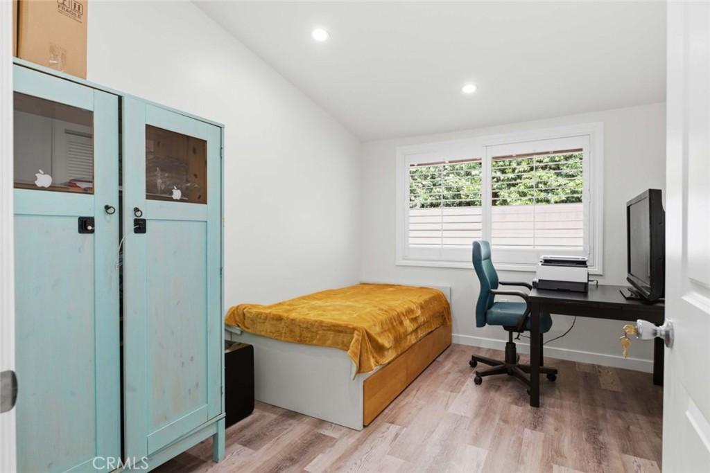 301 West Ashby Street Azusa, CA 91702 - Photo 54 of 75 a bedroom with a bed and a desk