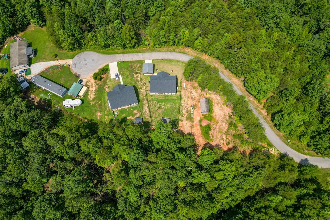 67 Sawblade Ridge Marietta, SC 29661 - Photo 32 of 37 Mature woodlands envelope this private mountain clearing with multiple residential structures.