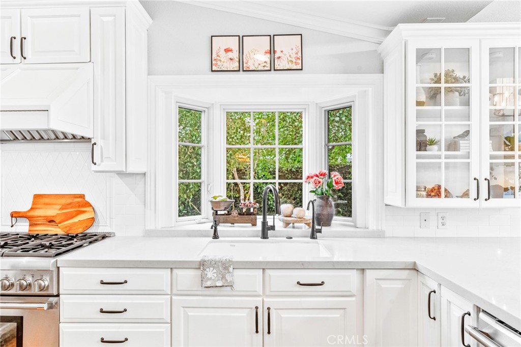 2933 Estancia San Clemente, CA 92673 - Photo 17 of 59 a kitchen with stainless steel appliances granite countertop a sink and a window