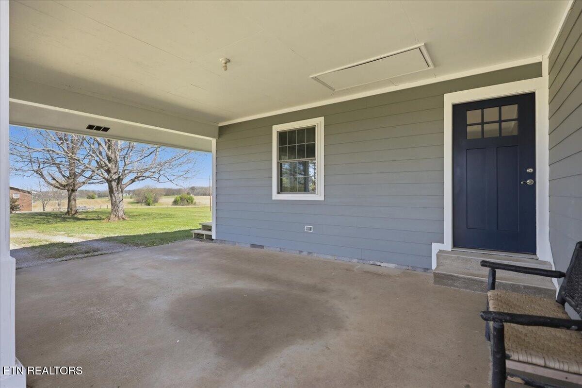 213 Lou Goddard Lane Greenback, TN 37742 - Photo 20 of 34 a view of a house with a backyard and a garden