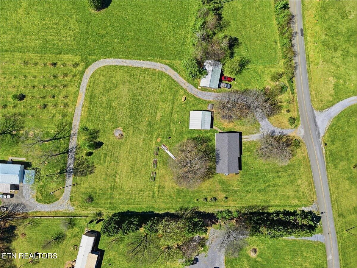 213 Lou Goddard Lane Greenback, TN 37742 - Photo 22 of 34 an aerial view of a residential houses with yard