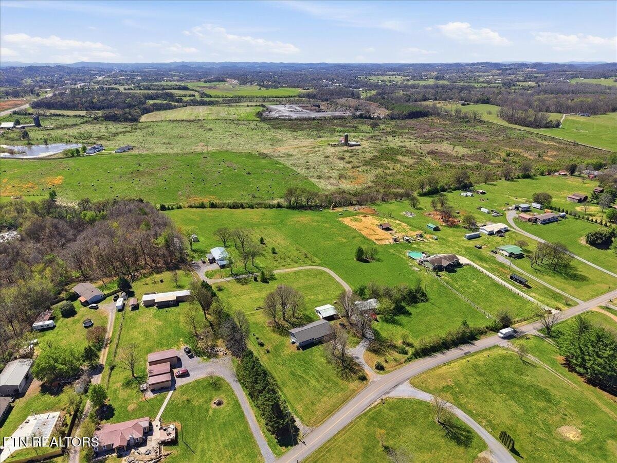 213 Lou Goddard Lane Greenback, TN 37742 - Photo 23 of 34 an aerial view of a houses with a lake