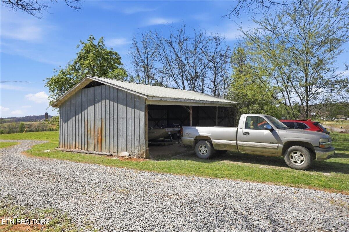 213 Lou Goddard Lane Greenback, TN 37742 - Photo 33 of 34 a front view of a house with garden