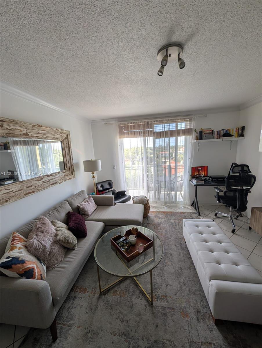 3500 Coral Way, Unit 505 Miami, FL 33145 - Photo 12 of 18 a living room with furniture and a large window