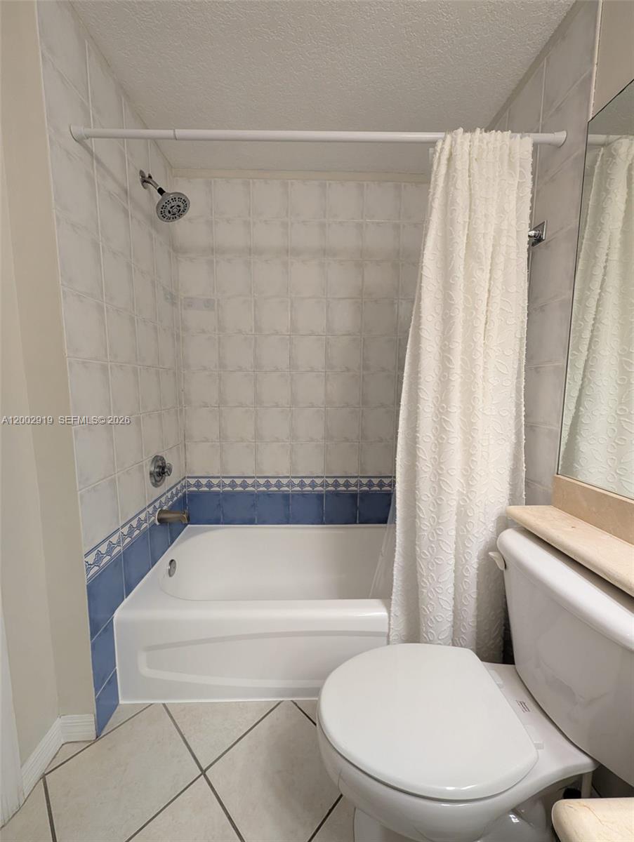 3500 Coral Way, Unit 505 Miami, FL 33145 - Photo 13 of 18 a white toilet and tub sitting next to a shower