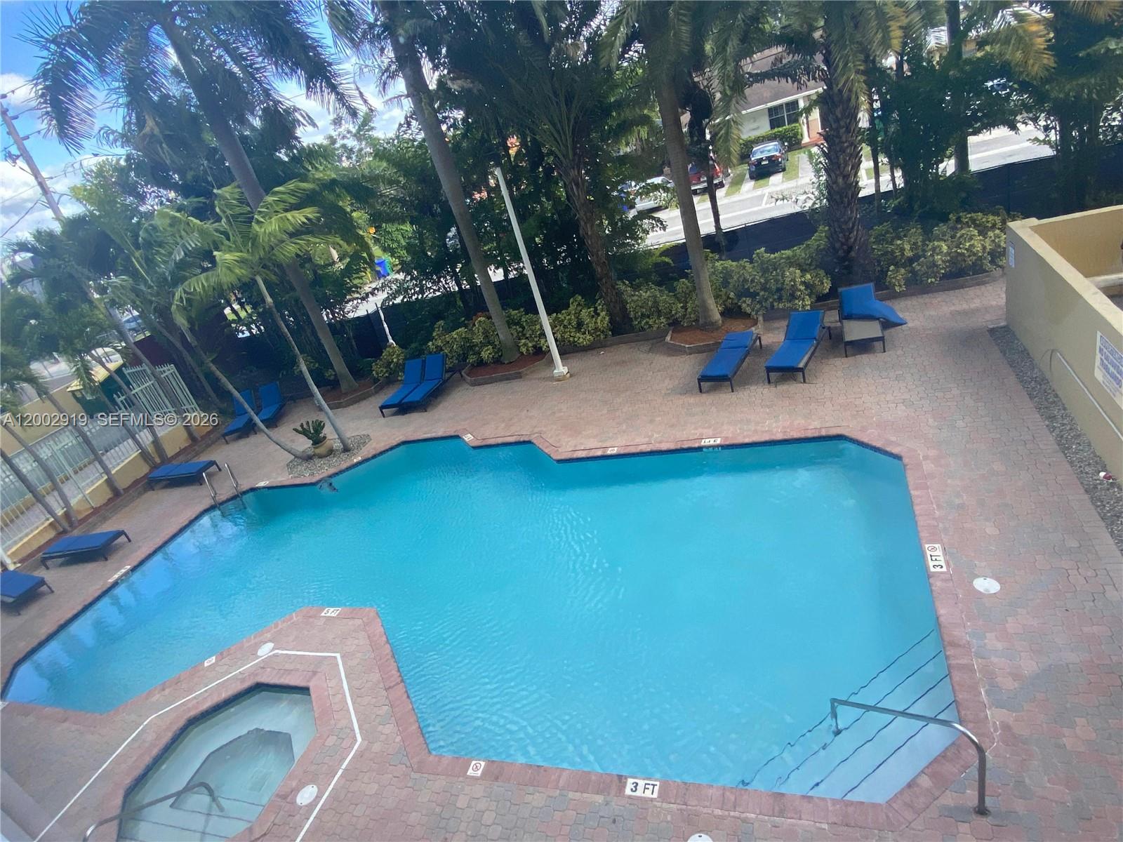 3500 Coral Way, Unit 505 Miami, FL 33145 - Photo 4 of 18 a view of a backyard with plants and a patio