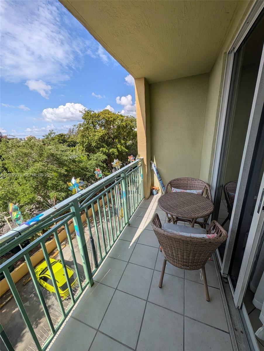 3500 Coral Way, Unit 505 Miami, FL 33145 - Photo 8 of 18 a view of balcony with furniture