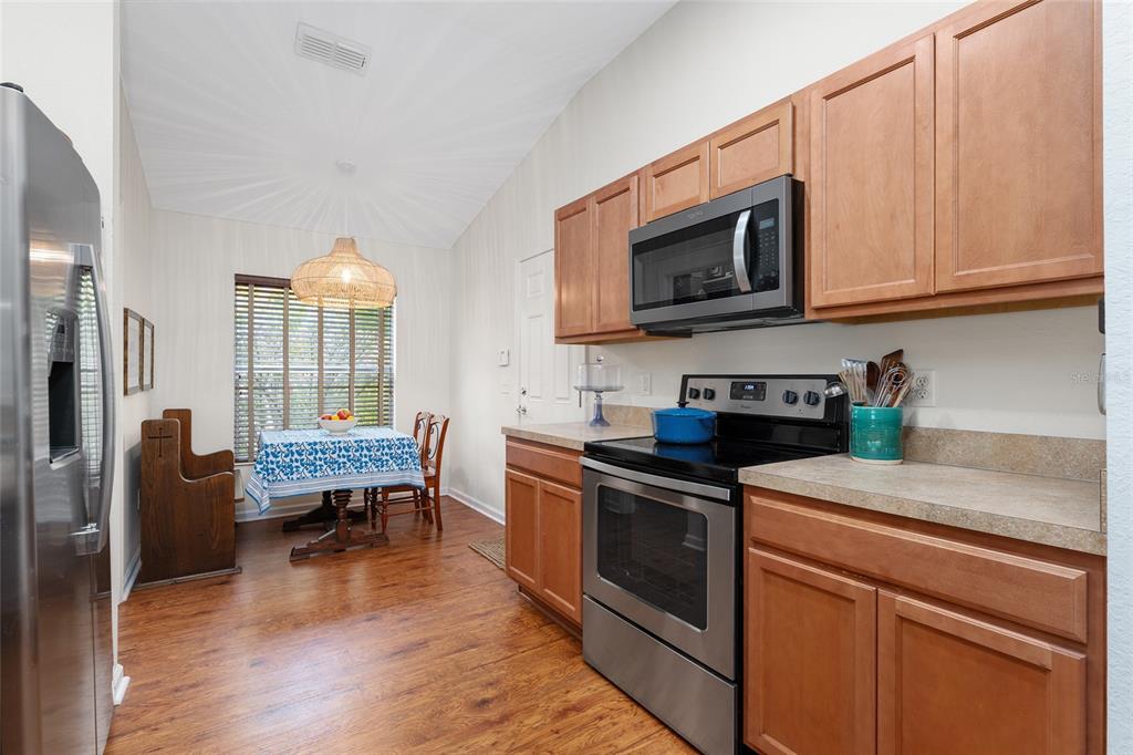 4080 Southwest 47th Court Ocala, FL 34474 - Photo 11 of 50 a kitchen with stainless steel appliances a stove a sink and a microwave