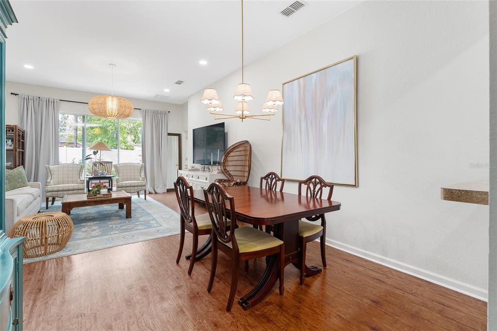 4080 Southwest 47th Court Ocala, FL 34474 - Photo 17 of 50 a view of a a dining room with furniture window and wooden floor