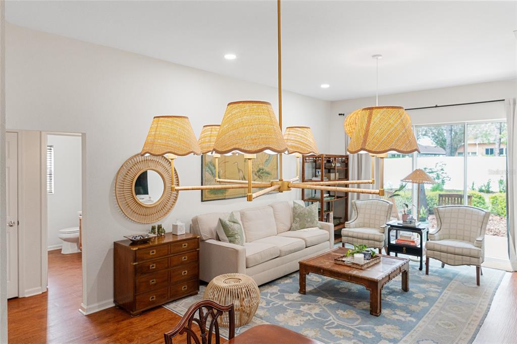 4080 Southwest 47th Court Ocala, FL 34474 - Photo 21 of 50 a living room with furniture a rug and wall painting