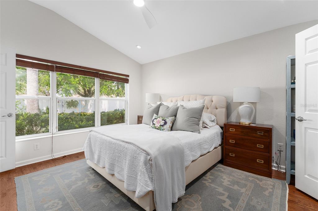 4080 Southwest 47th Court Ocala, FL 34474 - Photo 30 of 50 a bedroom with a bed and a large window