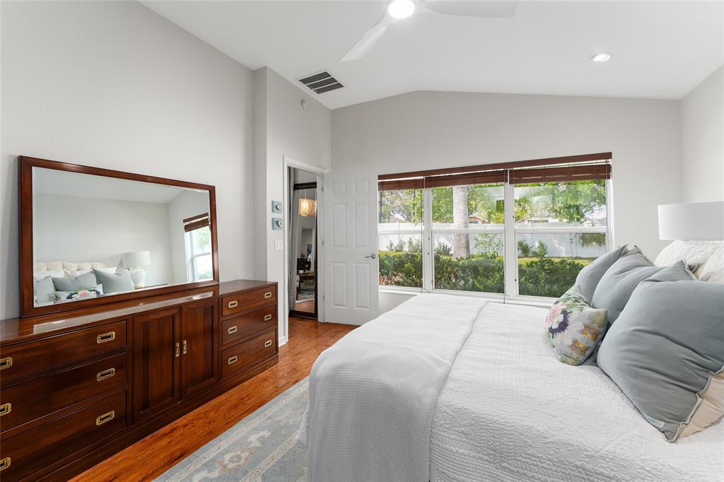 4080 Southwest 47th Court Ocala, FL 34474 - Photo 31 of 50 a bedroom with a bed and a large window