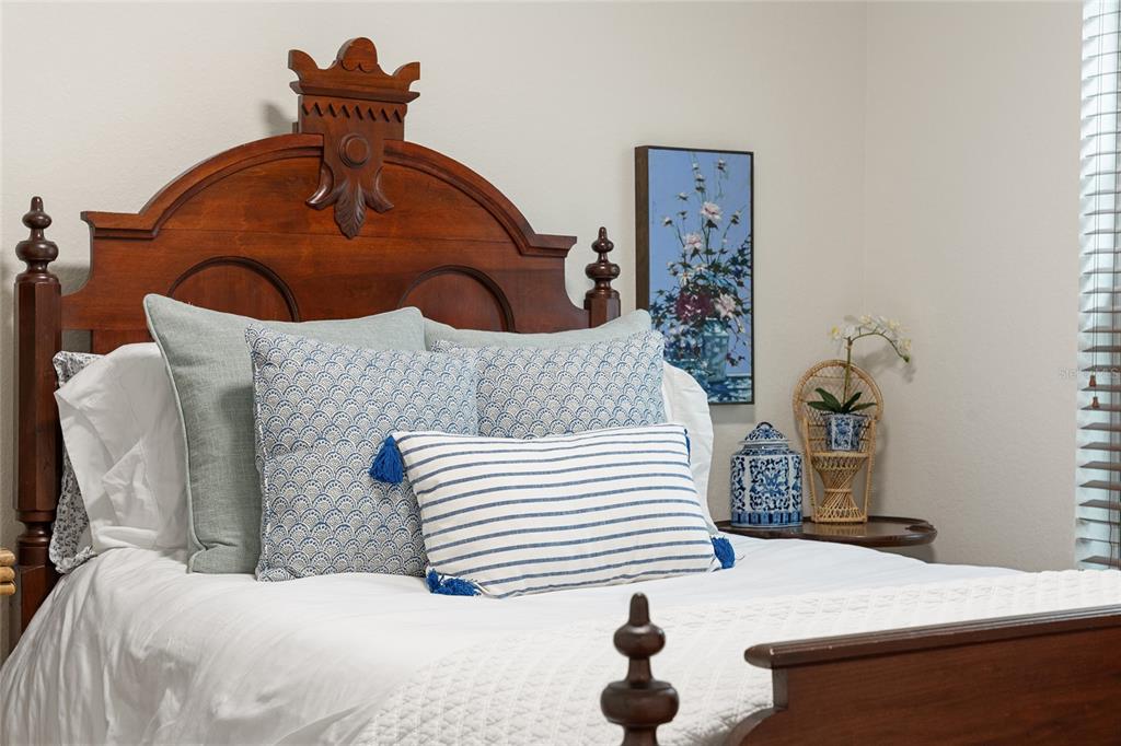 4080 Southwest 47th Court Ocala, FL 34474 - Photo 36 of 50 a bedroom with a bed and a chandelier