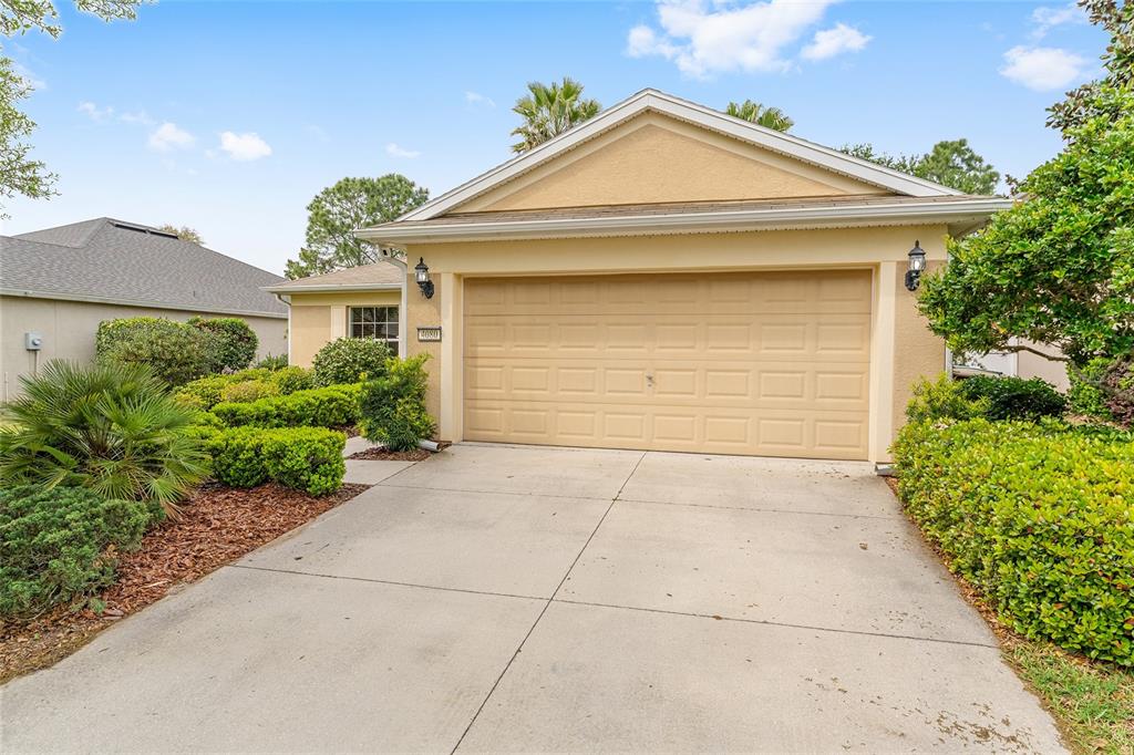 4080 Southwest 47th Court Ocala, FL 34474 - Photo 4 of 50 a front view of a house with a yard and garage