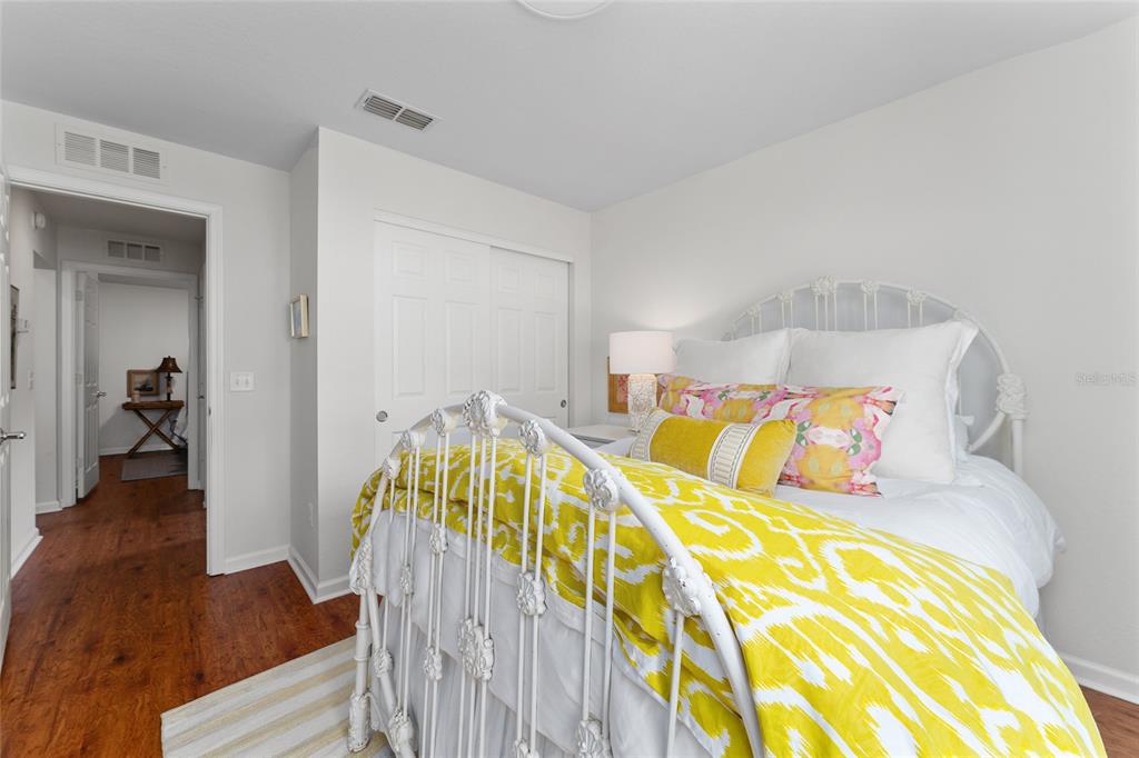 4080 Southwest 47th Court Ocala, FL 34474 - Photo 41 of 50 a view of a bedroom with wooden floor and furniture