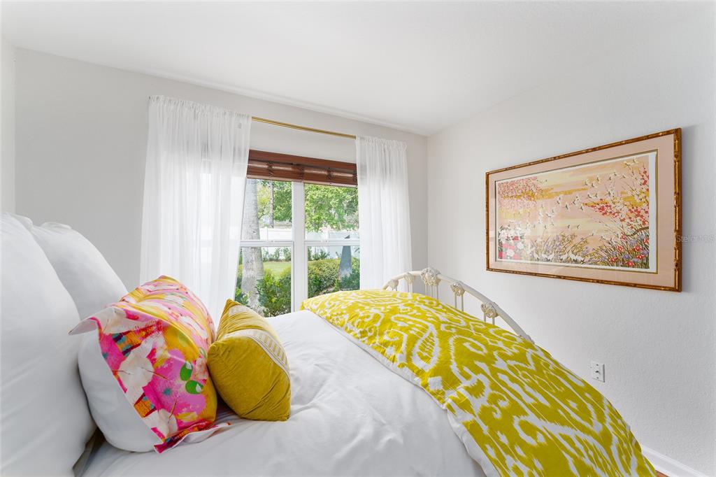 4080 Southwest 47th Court Ocala, FL 34474 - Photo 42 of 50 a bedroom with a bed and a painting on the wall