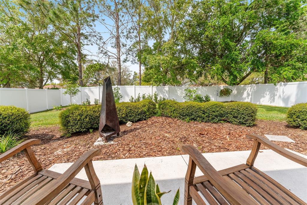 4080 Southwest 47th Court Ocala, FL 34474 - Photo 43 of 50 a view of backyard with seating space and trees