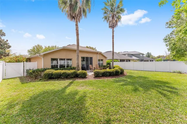 a front view of a house with swimming pool having outdoor seating