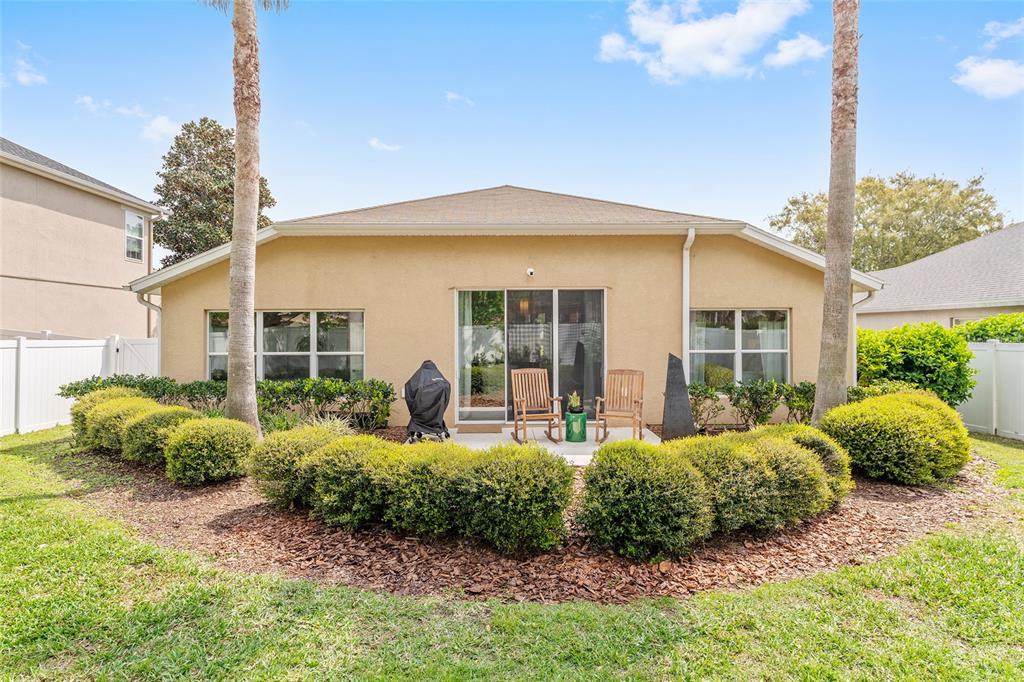 4080 Southwest 47th Court Ocala, FL 34474 - Photo 46 of 50 a front view of a house with garden