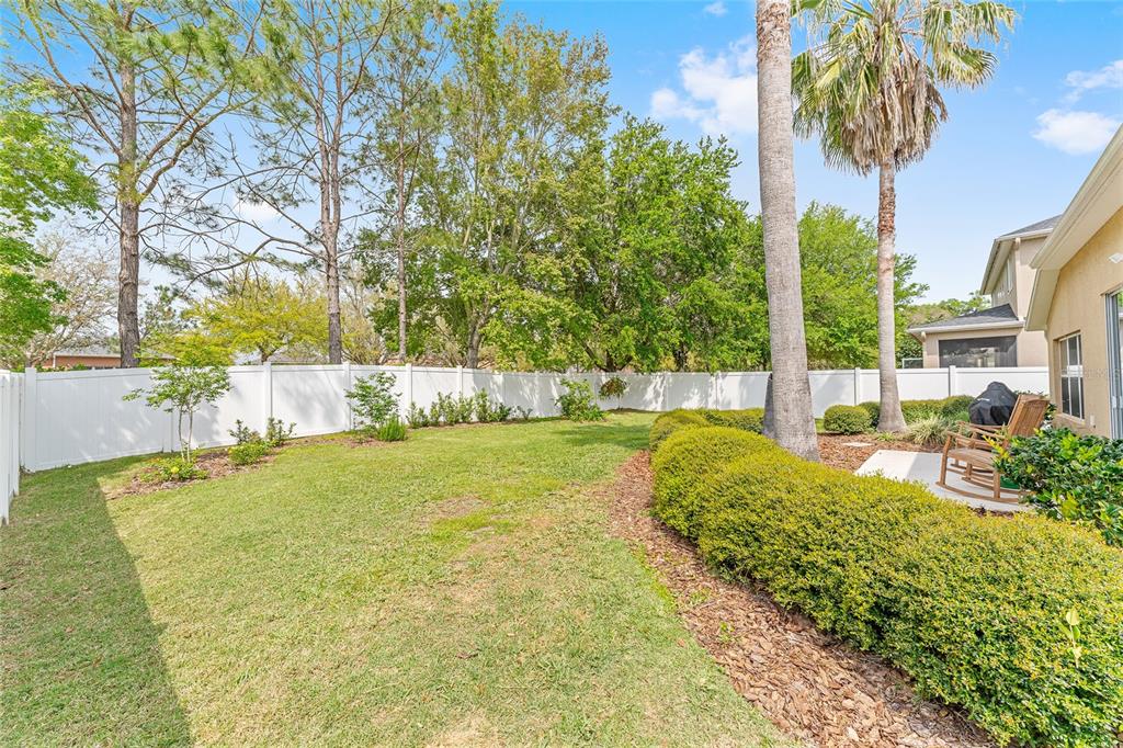 4080 Southwest 47th Court Ocala, FL 34474 - Photo 48 of 50 a view of backyard with swimming pool and seating space