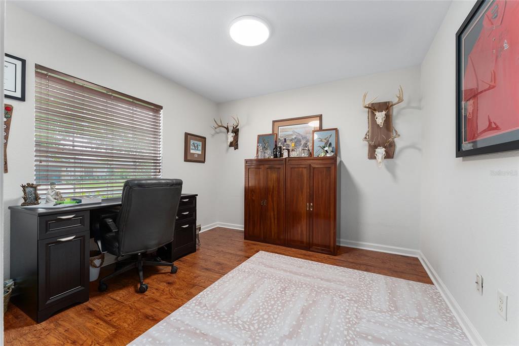 4080 Southwest 47th Court Ocala, FL 34474 - Photo 6 of 50 a view of a workspace with furniture and a window