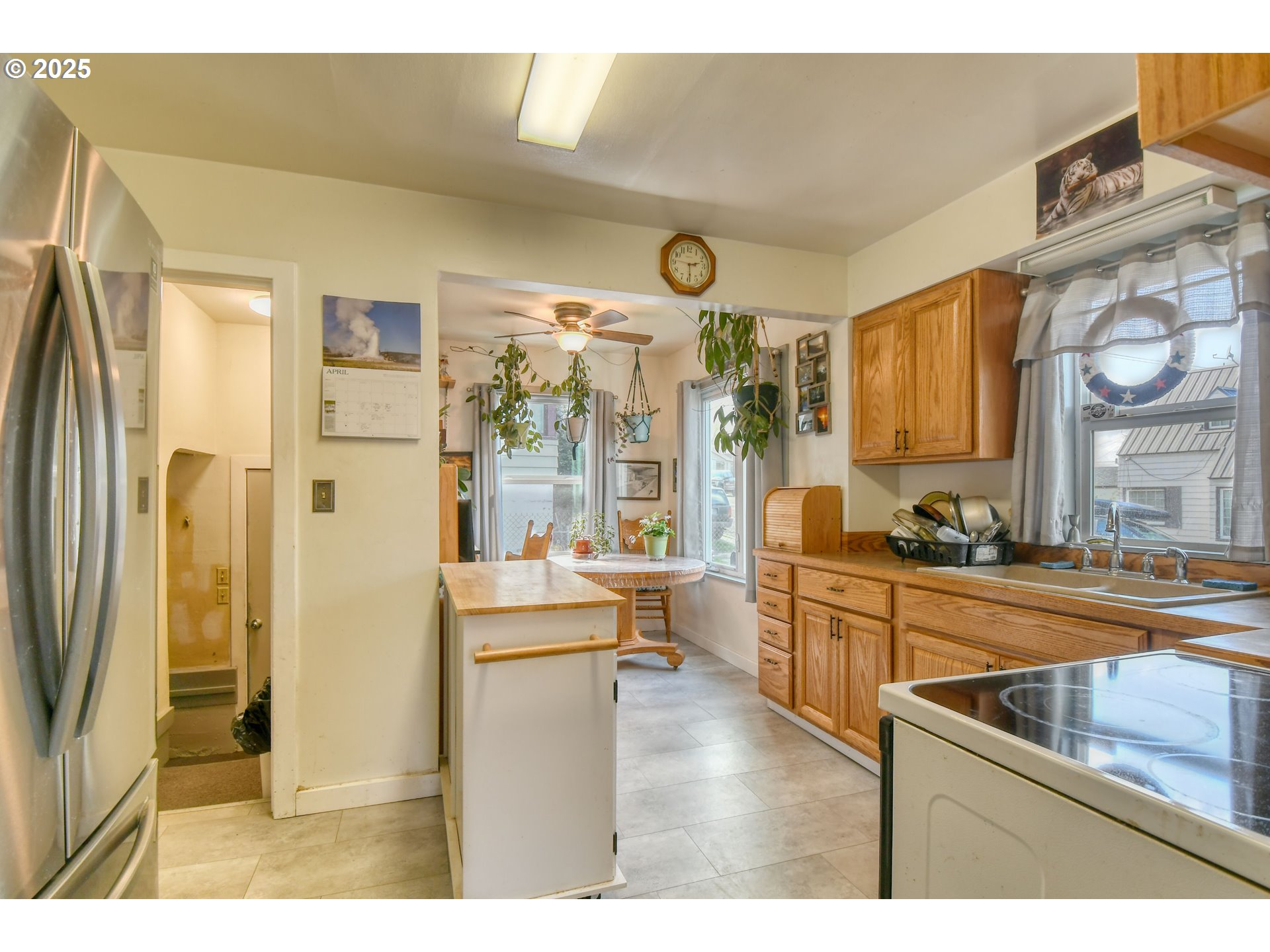 912 Southwest Goodwin Place Pendleton, OR 97801 - Photo 11 of 37 a kitchen with stainless steel appliances granite countertop a refrigerator and a sink