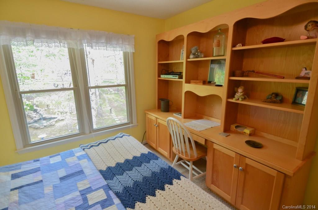 810 Old Williams Road Wingate, NC 28174 - Photo 18 of 24 a bedroom with a bed and a window
