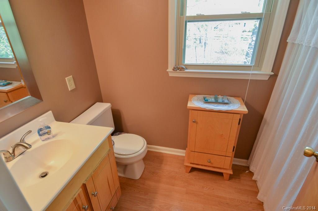 810 Old Williams Road Wingate, NC 28174 - Photo 19 of 24 a bathroom with a toilet sink and mirror