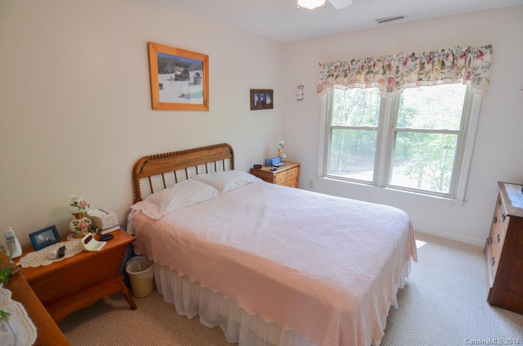 810 Old Williams Road Wingate, NC 28174 - Photo 20 of 24 a bedroom with a bed and a window