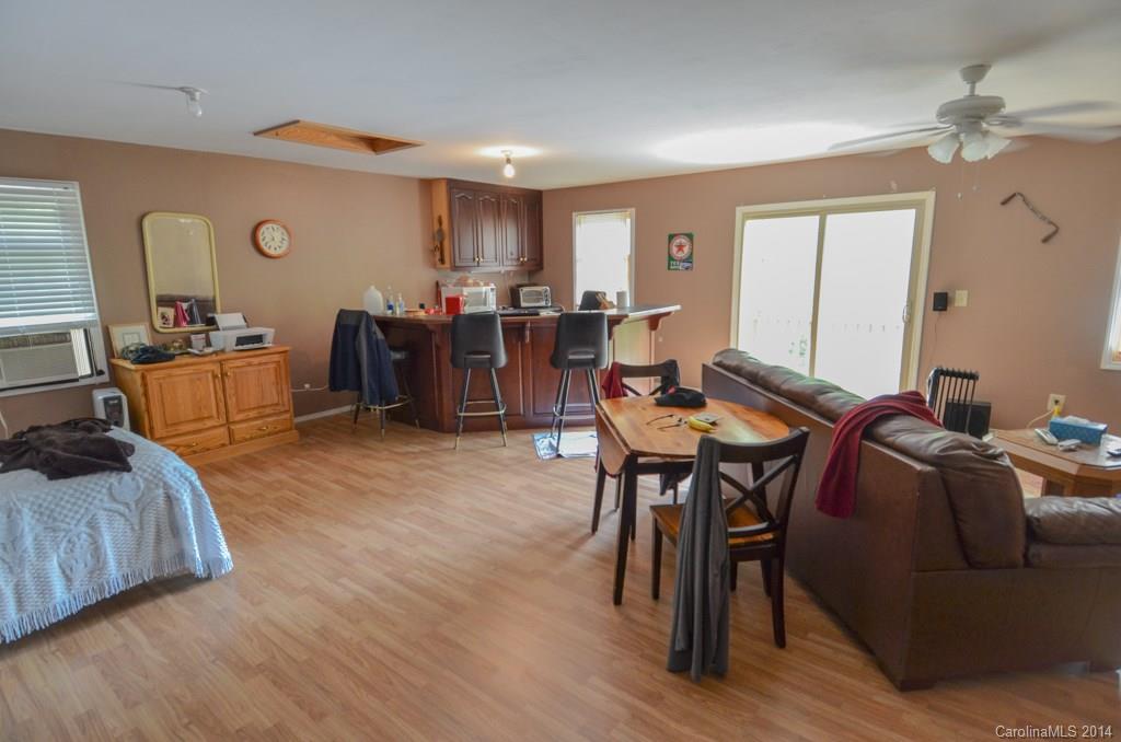 810 Old Williams Road Wingate, NC 28174 - Photo 24 of 24 a living room with furniture and a wooden floor