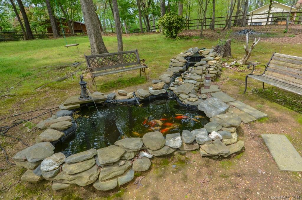 810 Old Williams Road Wingate, NC 28174 - Photo 7 of 24 a view of a lake with a yard
