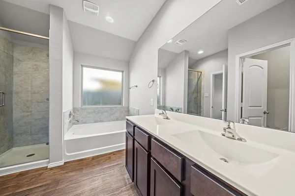 a bathroom with a bathtub and a sink
