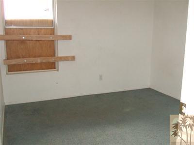 44313 Larrea Street Indio, CA 92201 - Photo 7 of 10 an empty room with a empty space