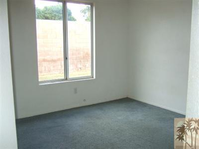 44313 Larrea Street Indio, CA 92201 - Photo 8 of 10 an empty room with a window