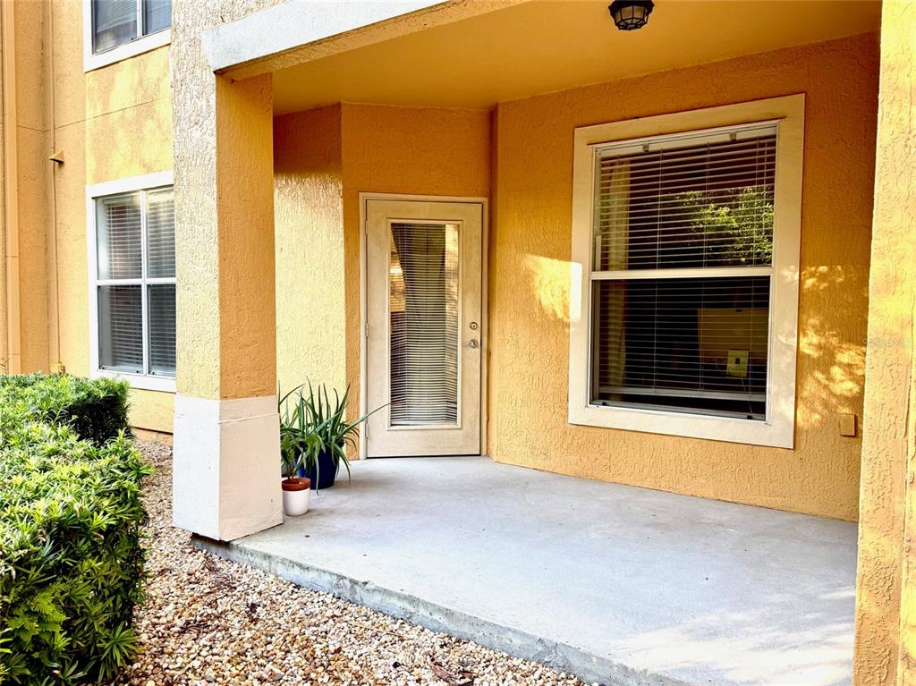 8842 Villa View Circle, Unit 108 Orlando, FL 32821 - Photo 14 of 25 a front view of a house having yard