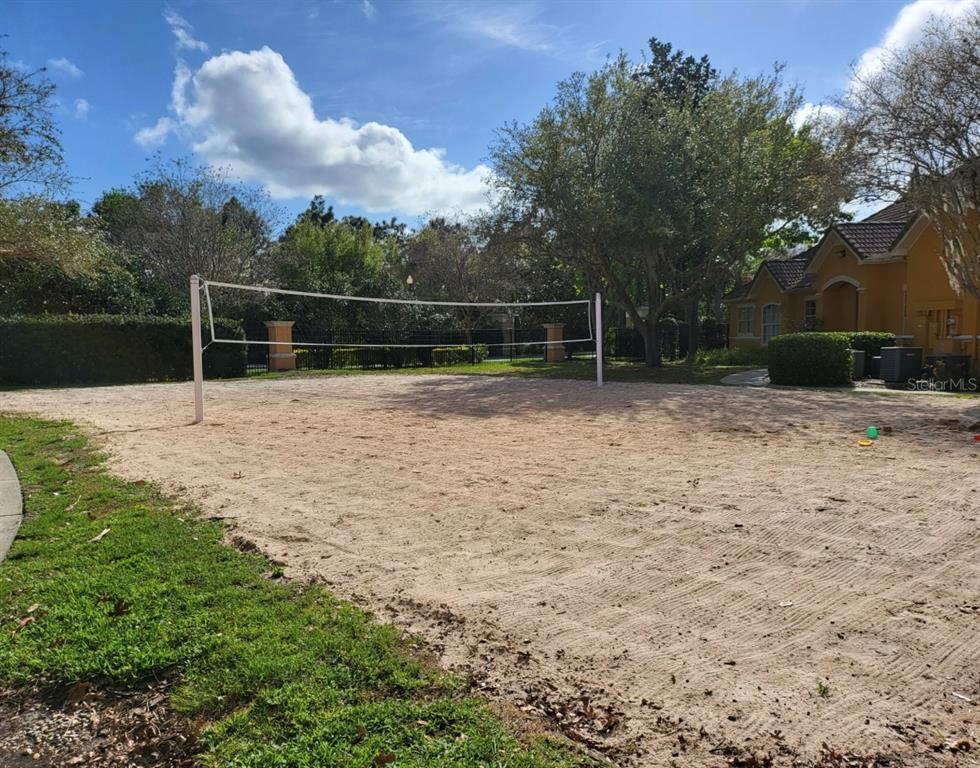 8842 Villa View Circle, Unit 108 Orlando, FL 32821 - Photo 21 of 25 a backyard of a house with lots of green space