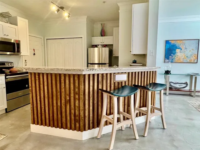 a view of kitchen with breakfast area