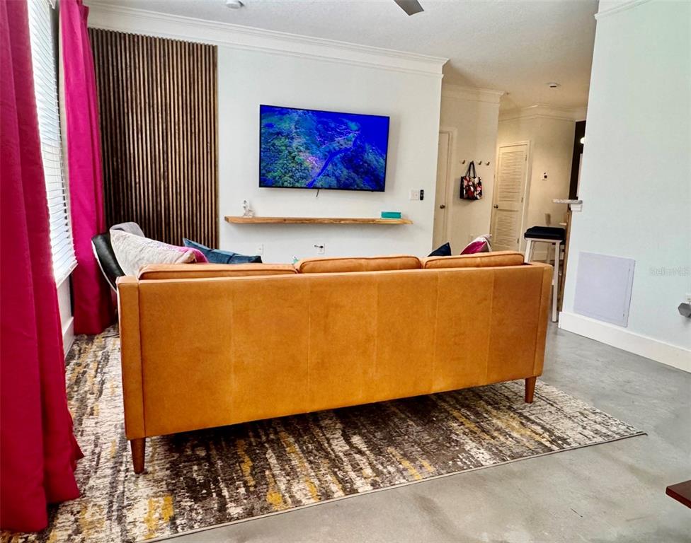 8842 Villa View Circle, Unit 108 Orlando, FL 32821 - Photo 6 of 25 a room with furniture and a window