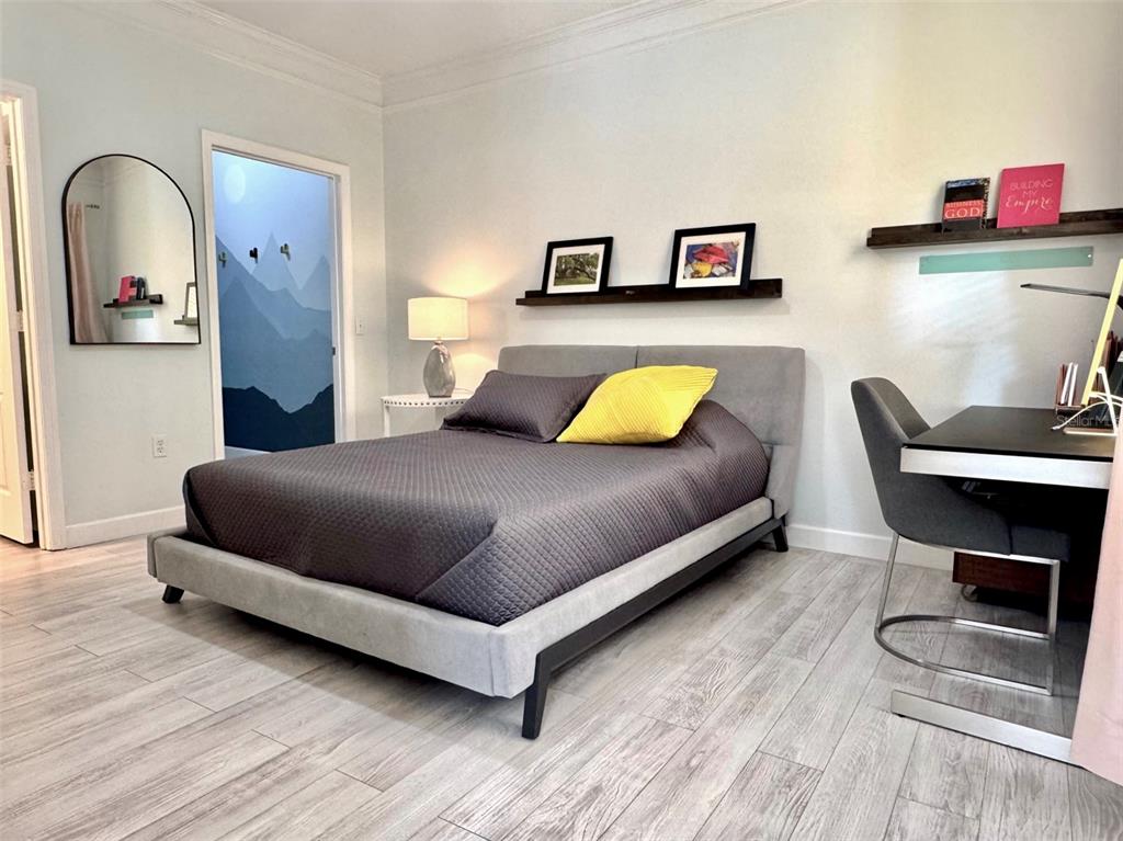 8842 Villa View Circle, Unit 108 Orlando, FL 32821 - Photo 8 of 25 a bedroom with a bed and dresser