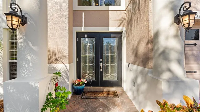 a front view of a house with outdoor seating