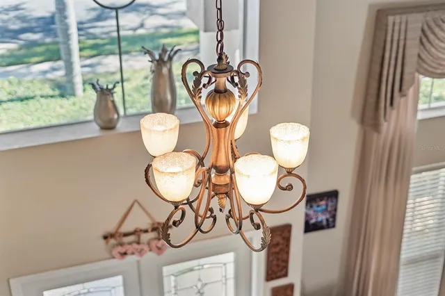 an aerial view of a house with a swimming pool